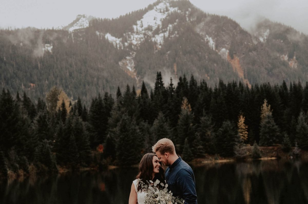 seattle, snoqualmie, elopement, goldcreek, northwest, washington, wedding, photographer, bouquet, moody, trees, lake, mountains, nature, water, white dress, couple, married, fog, reflection, mirror, pnw