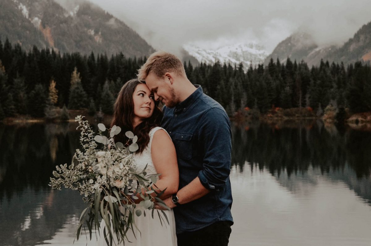 seattle, snoqualmie, elopement, goldcreek, northwest, washington, wedding, photographer, bouquet, moody, trees, lake, mountains, nature, water, white dress, couple, married, fog, reflection, mirror, pnw