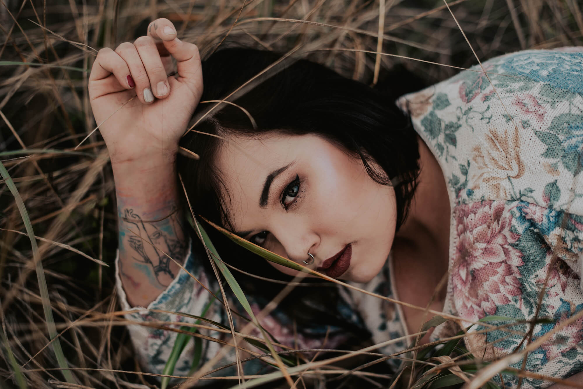 woman lying in tall grass in port angeles wa