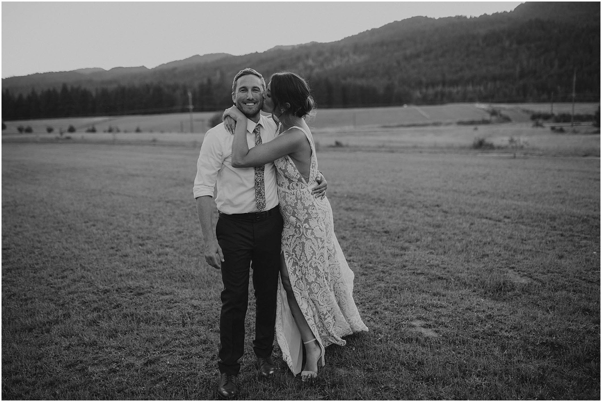 black and white wedding portrait, bride and groom on wedding day, tin roof barn