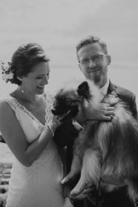 bride and groom with their dog on wedding day, seattle wa
