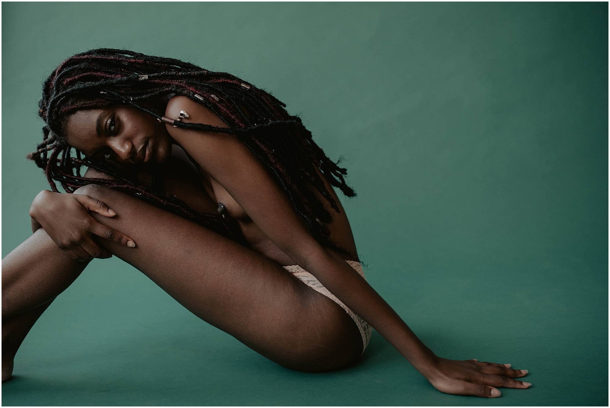 creative boudoir posing on colorful background