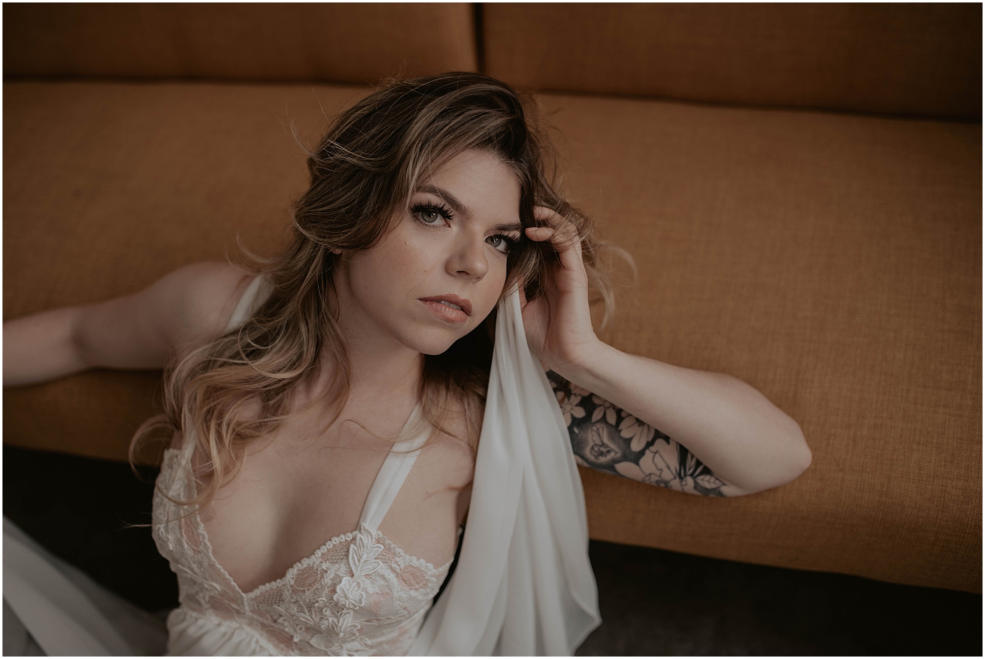 posing against chair on floor, indoor boudoir seattle 