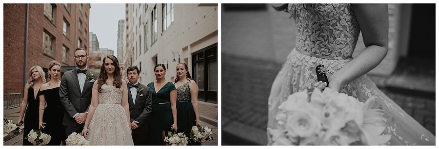bride with her bridal party standing in alleyway in white and dark green