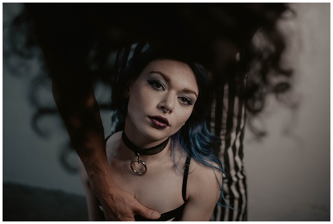couples kink boudoir in seattle studio, black and white striped pants, handcuffs, blue hair, dom and sub,