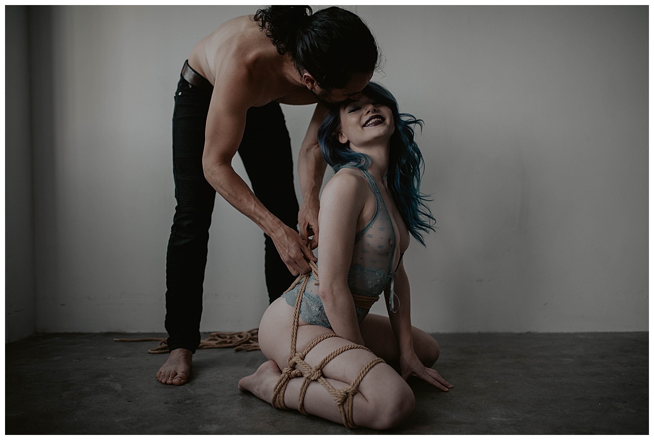 couples kink boudoir in seattle studio, rope ties, handcuffs, blue hair, dom and sub,