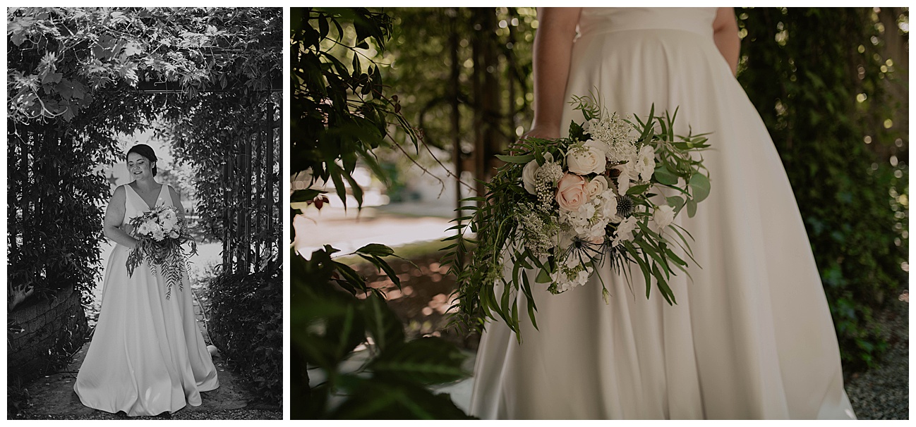 bride with all white bouquet and elegant white wedding dress standing under a vine covered trellis 
