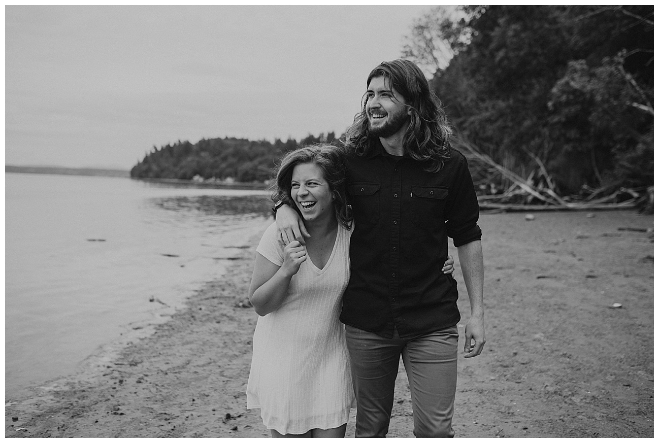couple walking on the beach with long hair