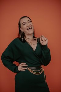 woman in green dress posing with soul chains