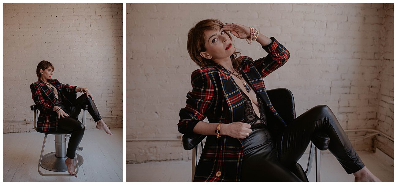 woman sitting on chair in black lingerie bodysuit and black leather pants