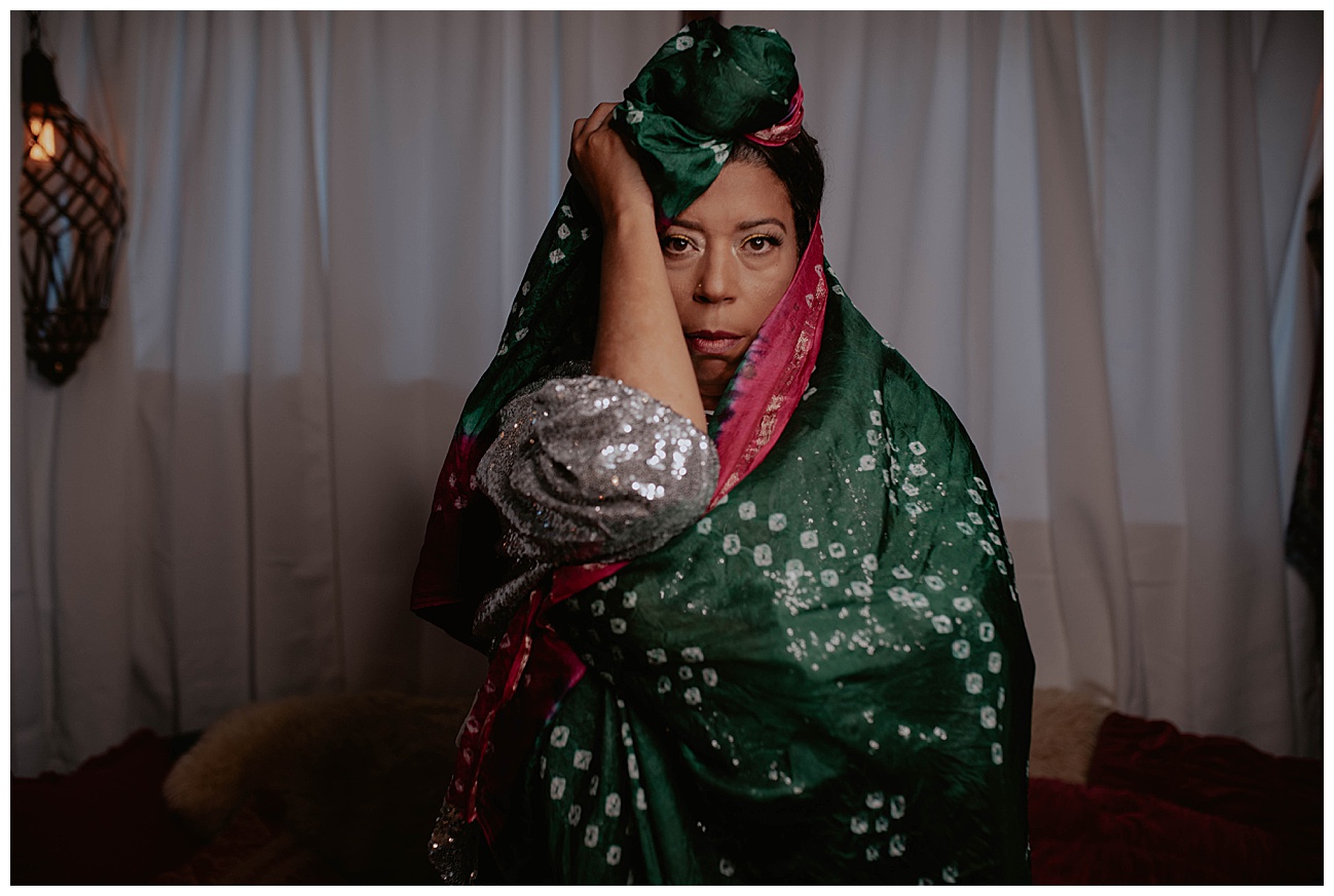 Seattle Brand Photography - Rainbow's Soul Chains of Ola Wyola in Columbia City Seattle by Kendra K Photo kendrakphoto.com woman wrapped up in colorful headscarf wearing a sparkly silver dress