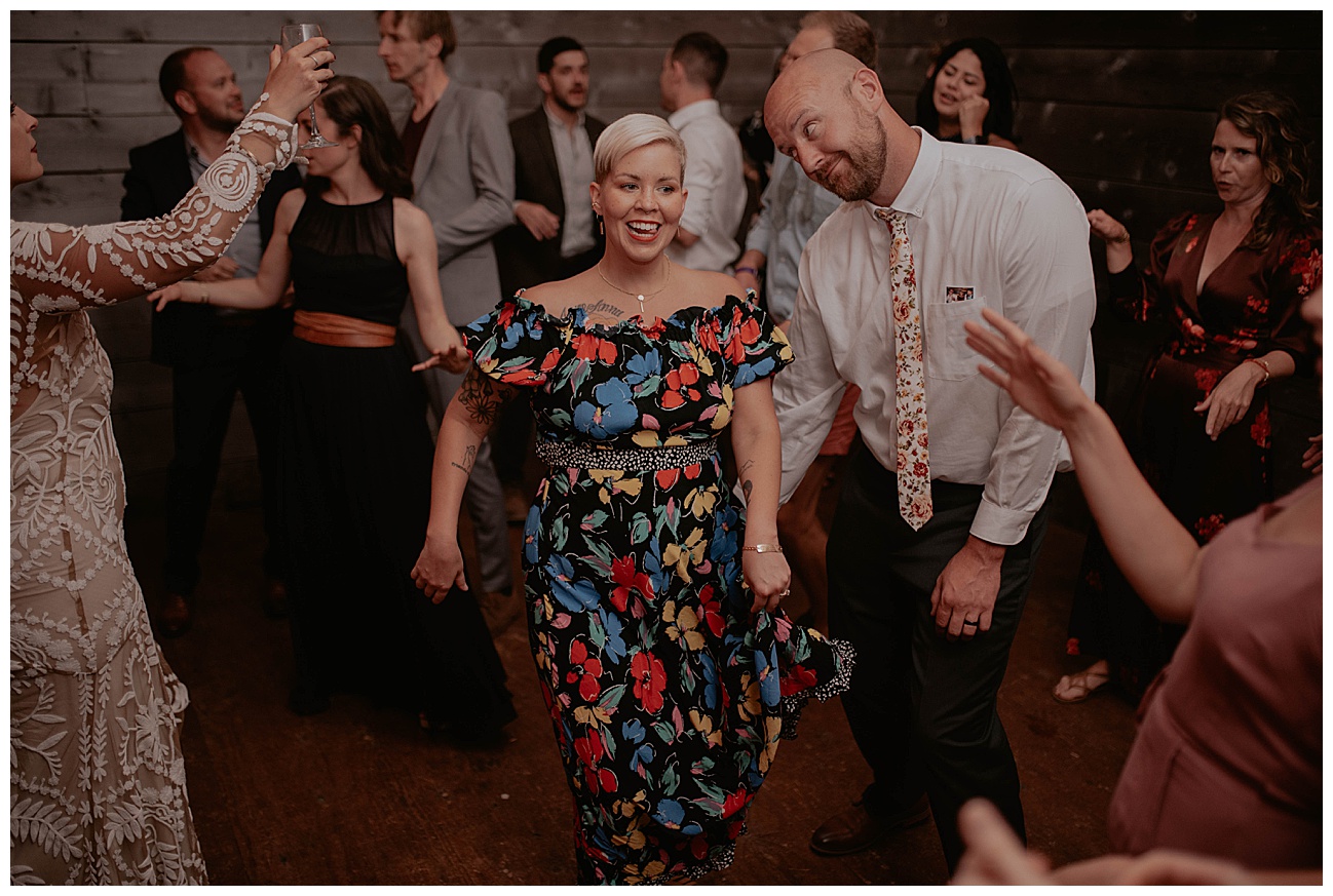 wedding guest making funny faces on dance floor